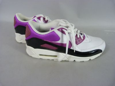 purple and white nike air max sneakers on a white surface