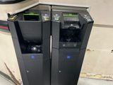 two trash bins sitting next to each other on the floor