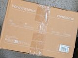 a cardboard box that is sitting on the ground