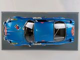 a blue toy car on display in a display case