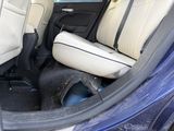 a seat in the back of a car that is dirty