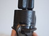 a person holding a black object in their hand