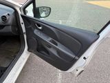a car door open with the driver ' s seat down