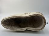 a close up of a pair of shoes on a white surface