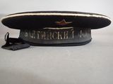 a black hat with a red star on it