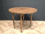 an image of a wooden table on a parquet floor