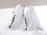 pair of white scarfs with black and white design on them