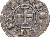 a silver coin with a cross on the front of it