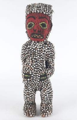 a close up of a sculpture of a person wearing a mask