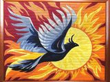 peinture représentant un oiseau volant devant un soleil sur un mur de briques