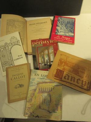 many books that are sitting on a table