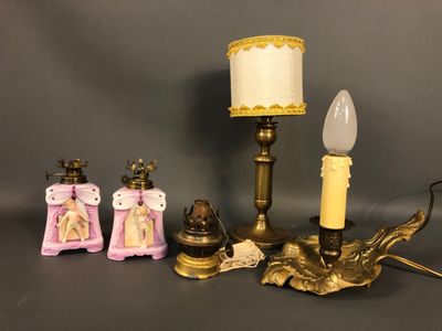 a lamp that is sitting next to a couple of figurines