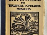 un vieux livre sur lequel figure l'image d'un dragon