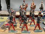 many figurines of soldiers that are on a table