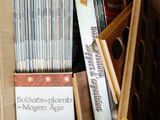 a cardboard box full of cds and cds in it