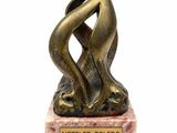 statue of a woman holding a vase on a marble base