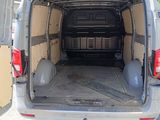 the back of a van with the door open and the back of the van with the back door open