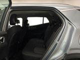 a car that has its door open and the back seat down