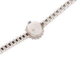 a close up of a watch on a white surface with a white background