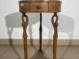 a small table with a drawer on top of it