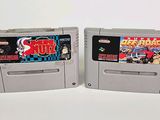 two nintendo games are shown side by side on a white surface