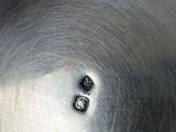 a close up of a metal pan with a metal lid