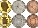 a close up of a group of coins with different faces