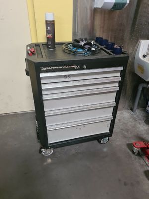 a black and white tool cabinet in a garage