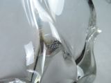a close up of a pair of scissors in a glass vase