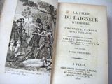 an old book with a picture of a man laying on the ground