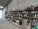 many pots and pans on the shelves in the warehouse