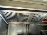 an image of a commercial kitchen with stainless steel appliances