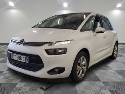the white citrole is parked on a checkered floor