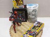 a table with some toys and a box of cereal