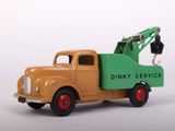a toy truck with a crane attached to the back of it