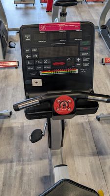 a tread machine in a gym with a monitor on it