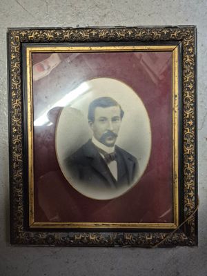 a picture of a man in a tuxedo in a picture frame