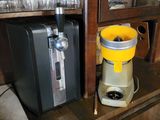 a yellow and black blender sitting on top of a wooden counter