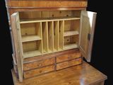 a wooden desk with a wooden cabinet on top of it