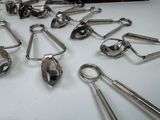 many spoons and spoon spoons sitting on a table