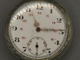 a close up of a pocket watch with numbers on it