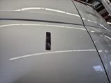 a close up of a car with a remote control on the hood