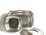 a silver tray with a silver lid and a silver tray with a silver lid