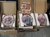 four plates in a box that are sitting on top of each other
