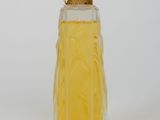 a bottle of perfume sitting on a white surface