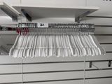 a picture of a rack with a bunch of clothes hanging on it