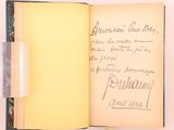 an open book with writing on it sitting on a table