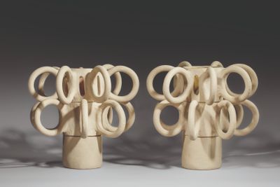 two vases that are shaped like a tree