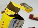 a box of cigarettes sitting on a table next to a box of cigarettes
