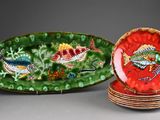 several plates with different designs are stacked on top of each other